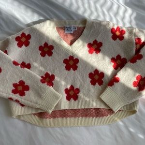 Princess Polly cropped v-neck sweater w/ flower prints, light wooly material.